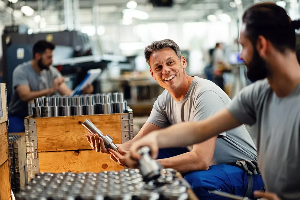 experienced male specialist discussing safety in factory