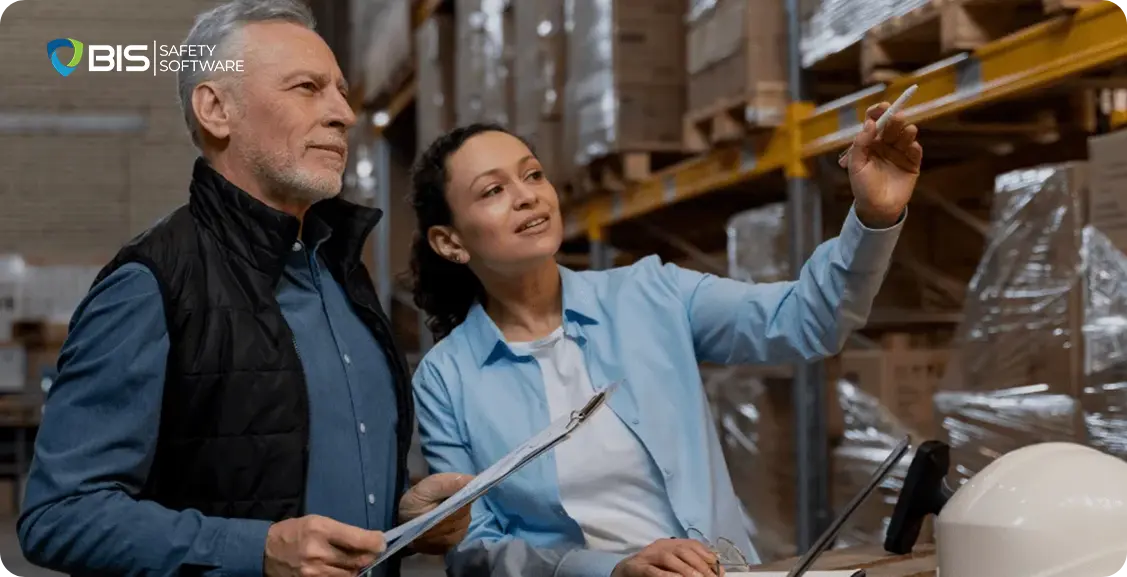 Two workers auditing the stock